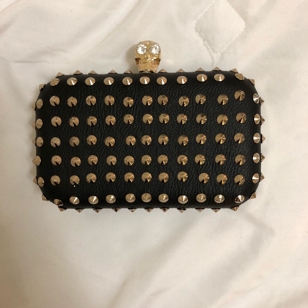 Black and gold studded clutch